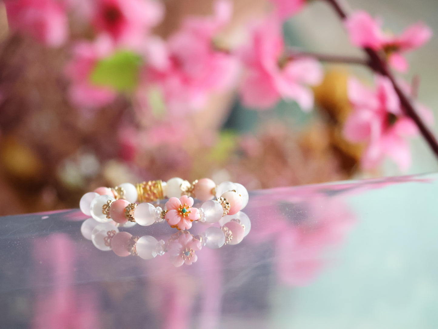 *INSTOCKS* Cheru Customs - Queen Conch, Snow Garden Rose Quartz, White Chalcedony & White Phantom Quartz with Queen Conch Sakura Flower Charm Crystal Bracelet